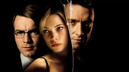 HD PC desktop wallpaper featuring Hugh Jackman alongside two other characters from the movie Deception, with a split, cracked glass effect highlighting themes of intrigue.