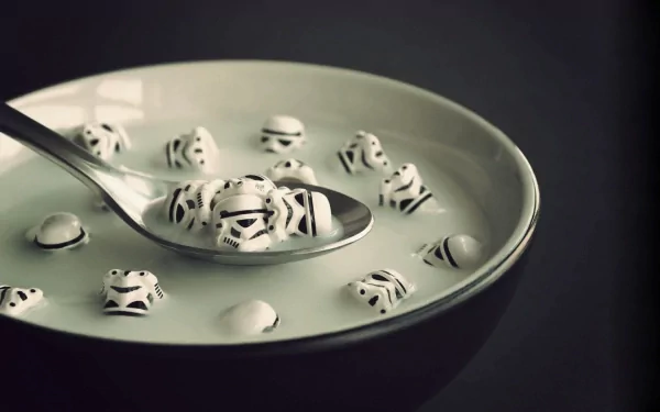 HD desktop wallpaper of a bowl of milk with floating stormtrooper marshmallows from Star Wars, with a spoon scooping some up. The image combines humor and food themes.