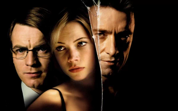 HD PC desktop wallpaper featuring Hugh Jackman alongside two other characters from the movie Deception, with a split, cracked glass effect highlighting themes of intrigue.