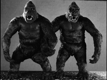 A striking HD wallpaper featuring King Kong figures from the classic 1933 film, showcasing the iconic giant gorilla in an expressive and dynamic pose.