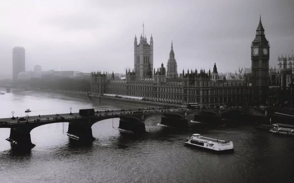 A misty view of London featuring the iconic Big Ben and the Houses of Parliament, captured from a bridge over the River Thames, creating a stunning desktop wallpaper.