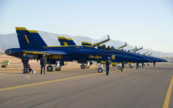 Navy Blue Angels McDonnell Douglas F/A-18 Hornet aircraft lined up on runway, showcasing military precision and sleek design in an HD desktop wallpaper.
