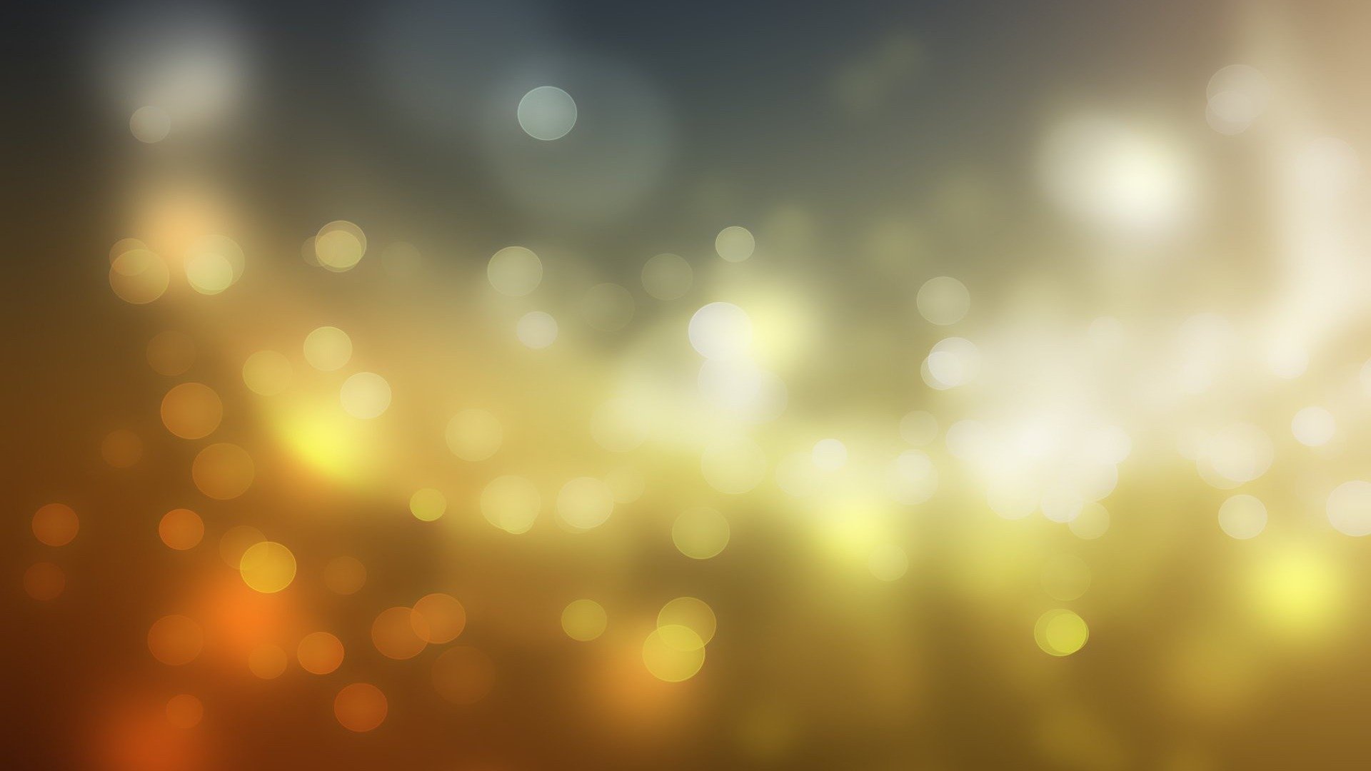 Artistic bokeh effect with golden and white light orbs creating a soft, abstract HD PC desktop wallpaper background.