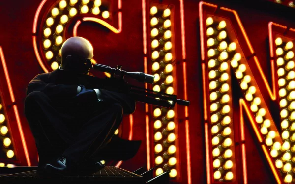 HD PC desktop wallpaper from the video game Hitman: Absolution, featuring Agent 47 crouched with a sniper rifle against a bright casino sign backdrop.