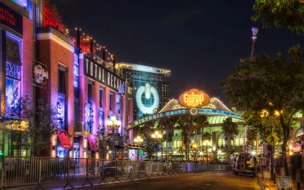 A vibrant, man-made urban scene in San Diego at night, captured in stunning 4K Ultra HD quality showcasing colorful lights and lively architecture.
