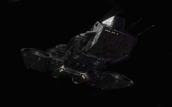HD PC desktop wallpaper featuring a detailed spaceship from the TV show Stargate SG-1 against a black starry background.