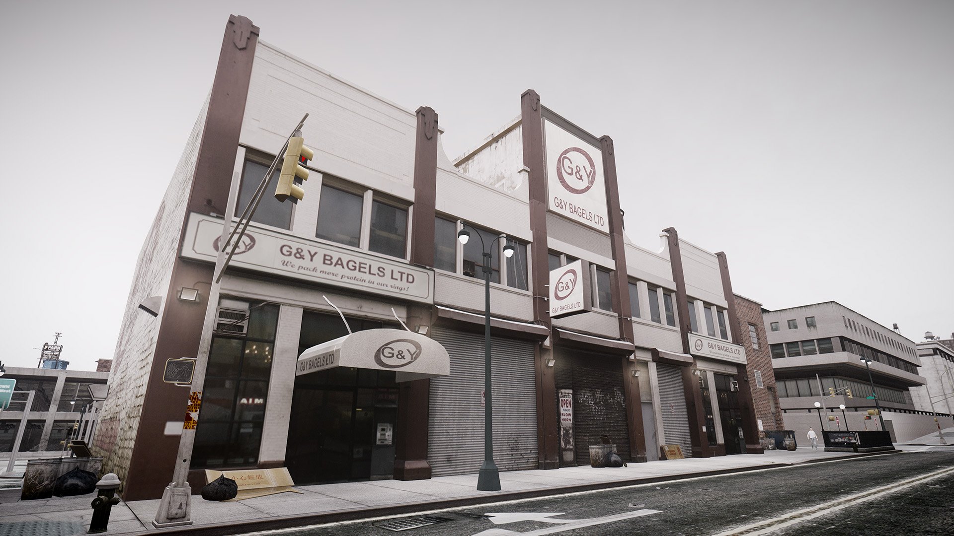 HD wallpaper from Grand Theft Auto IV featuring an in-game urban building with G&Y Bagels Ltd signage.