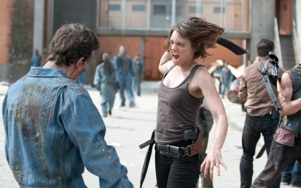 Maggie Greene, portrayed by Lauren Cohan, fiercely battles a zombie in a dramatic scene from the TV show The Walking Dead, capturing the intensity of the post-apocalyptic world.