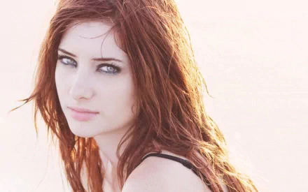 HD PC desktop wallpaper featuring a close-up portrait of celebrity Susan Coffey with natural lighting and a soft, neutral background.