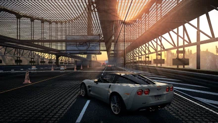 HD wallpaper of Need For Speed: Most Wanted featuring a sports car on an urban bridge at sunset.