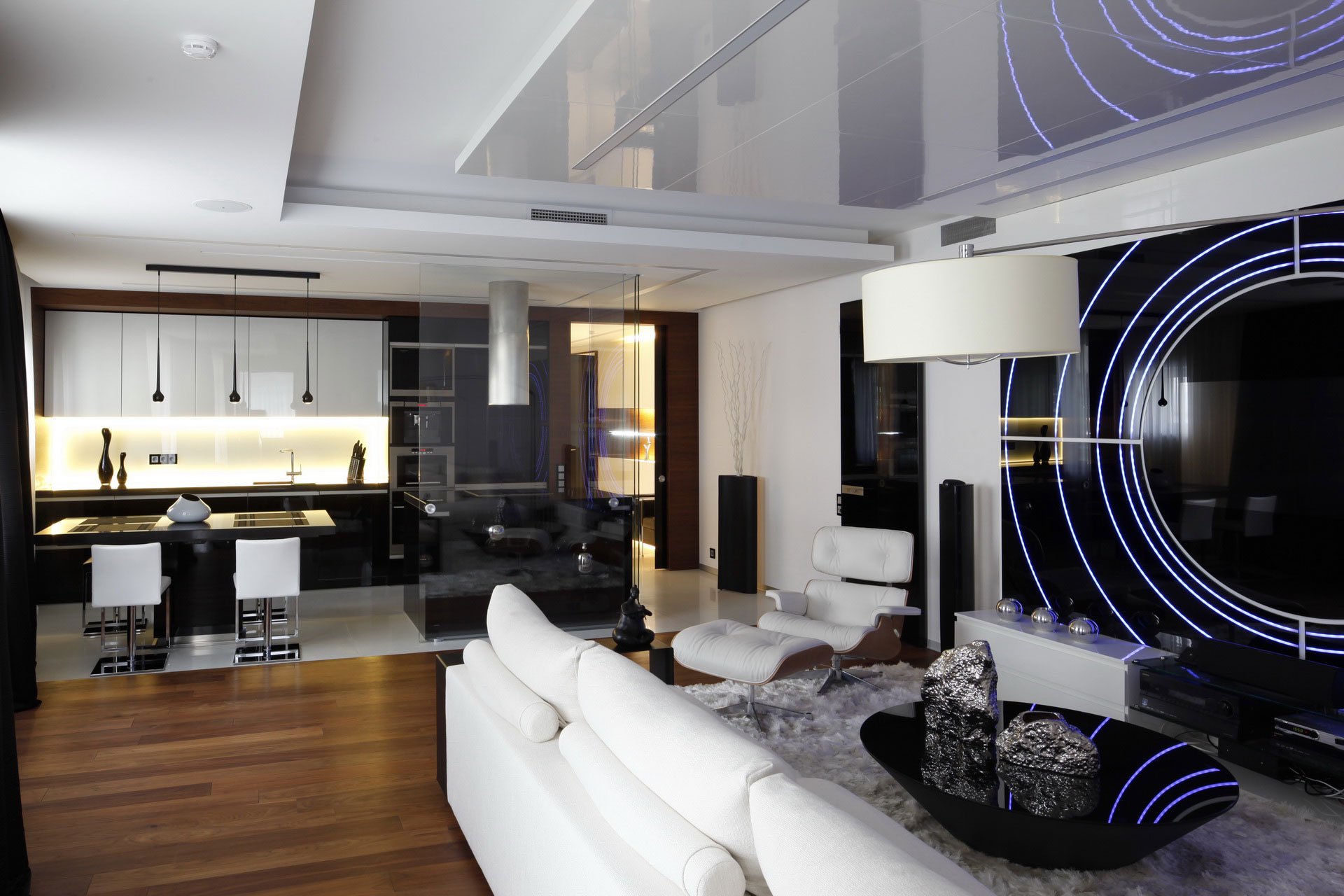 HD PC desktop wallpaper showing a modern man-made room with sleek white furniture, a stylish kitchen area, and ambient lighting creating a contemporary living space.