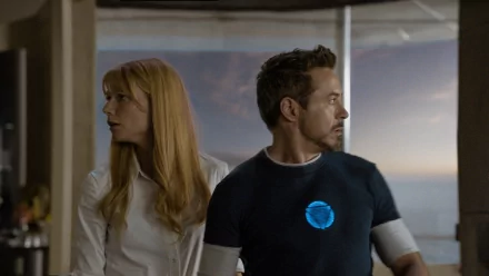 HD PC desktop wallpaper featuring Tony Stark and Pepper Potts from the movie Iron Man 3, showcasing a tense moment with realistic lighting and detail.
