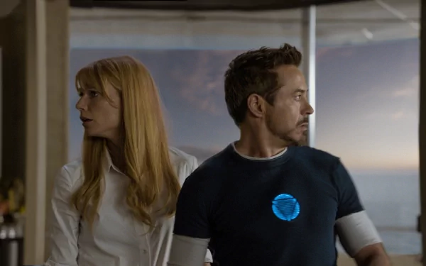 HD PC desktop wallpaper featuring Tony Stark and Pepper Potts from the movie Iron Man 3, showcasing a tense moment with realistic lighting and detail.
