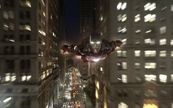 Iron Man soars through a vibrant cityscape at night in this HD Avengers movie wallpaper, showcasing action and excitement from the beloved franchise.