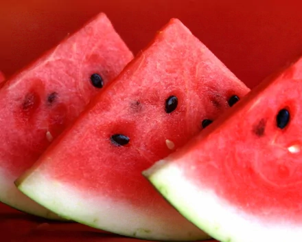 Close-up of juicy watermelon slices with seeds, displayed as a vibrant HD PC desktop wallpaper and background.