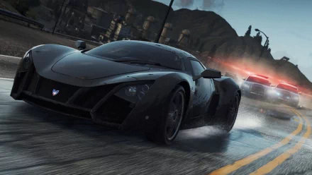 HD desktop wallpaper of a high-speed car chase from the video game Need For Speed: Most Wanted, featuring a sleek black sports car pursued by police cars with flashing lights.