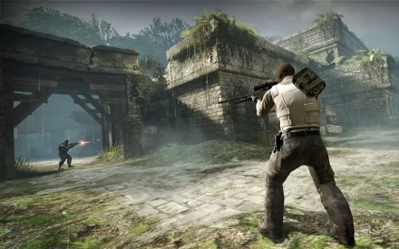 HD desktop wallpaper of a Counter-Strike: Global Offensive game scene featuring two players in a battle within a detailed, ancient ruins environment.