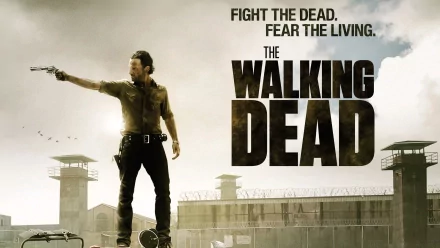 HD desktop wallpaper featuring Rick Grimes (Andrew Lincoln) from the TV show The Walking Dead, with the slogan Fight the dead. Fear the living. and a prison background.