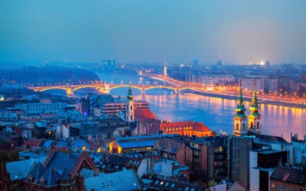 Evening view of Margaret Bridge over the Danube in Budapest, Hungary — illuminated man-made landmark rendered as an HD PC desktop wallpaper background.