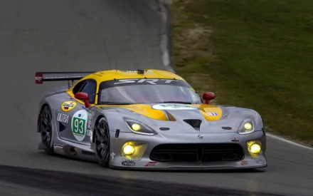 HD PC desktop wallpaper showing a silver-and-yellow Dodge SRT Viper GTS racing on a wet track with headlights on and racing number 93 on the door.
