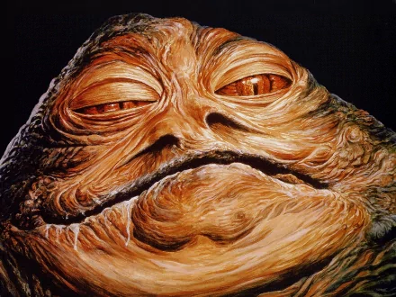 Close-up HD desktop wallpaper of Jabba the Hutt from the Star Wars movie, showcasing his detailed textured skin and distinct facial features.