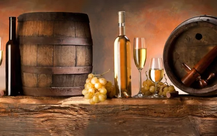 HD PC desktop wallpaper featuring a rustic food and wine setting with wooden barrels, white wine bottles, glasses, and fresh grapes on a wooden surface.