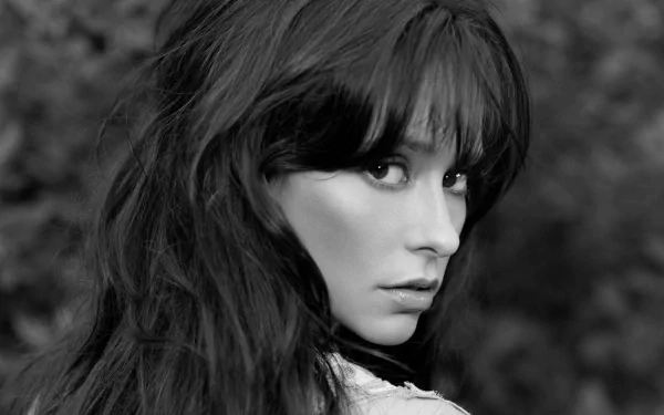Black and white HD desktop wallpaper featuring a close-up portrait of celebrity Jennifer Love Hewitt with long hair and an intense gaze.