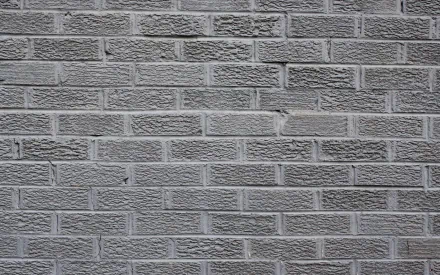 HD photography of a textured gray brick wall, used as a PC desktop wallpaper and background.