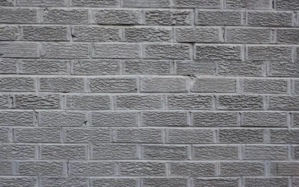 HD photography of a textured gray brick wall, used as a PC desktop wallpaper and background.