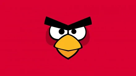 A vibrant HD desktop wallpaper featuring the iconic red bird from Angry Birds, set against a bold red background, capturing the game's playful and energetic spirit.