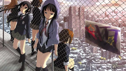 HD desktop wallpaper featuring characters Ritsu Tainaka, Mio Akiyama, Tsumugi Kotobuki, Yui Hirasawa, and Azusa Nakano from the anime K-ON! standing near a fence with a cityscape in the background.
