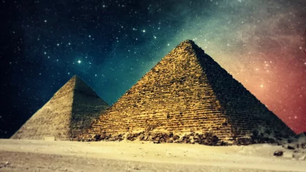 HD desktop wallpaper featuring two illuminated pyramids against a starry night sky background.