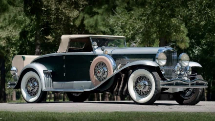 1929 Duesenberg Model J classic vehicle parked outdoors, showcased as a high-definition PC desktop wallpaper and background.