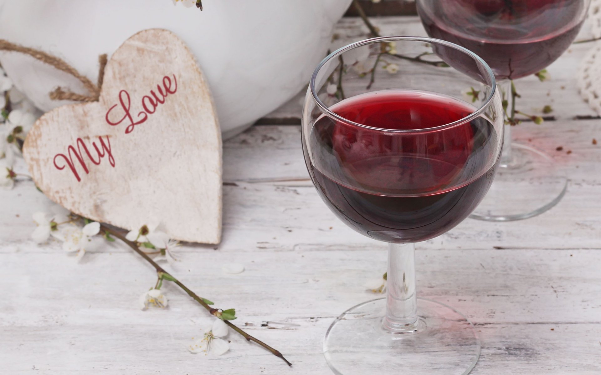 HD desktop wallpaper featuring two glasses of red wine on a white wooden surface, accompanied by a heart-shaped wooden decoration with My Love written on it.
