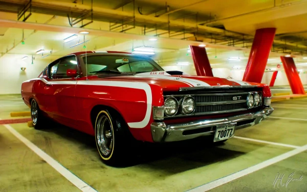 A red Ford Torino GT with white racing stripes parked in an indoor garage, showcased in 4K Ultra HD as a PC desktop wallpaper and background.