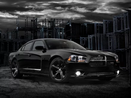 Sleek black Dodge Charger vehicle parked in a moody industrial lot, rendered as an HD PC desktop wallpaper and background.