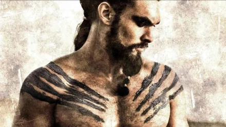 A striking HD wallpaper featuring Jason Momoa as Drogo from Game of Thrones, showcasing his intense expression and distinctive body markings against a textured background.