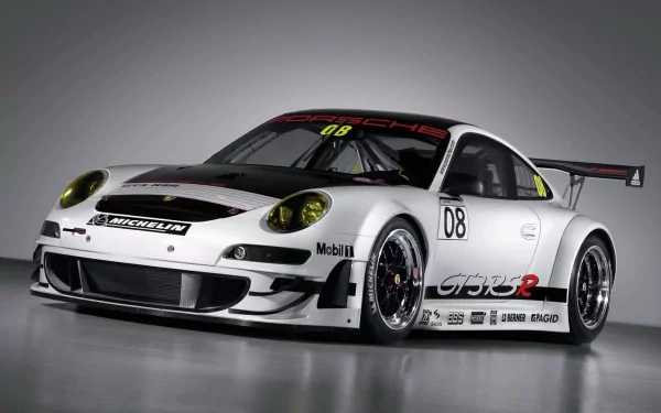 HD desktop wallpaper of a white Porsche 911 GT3 RSR race car showcasing sleek design and racing decals against a neutral background.