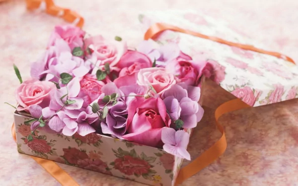 Vintage floral box filled with pink roses and man-made flowers, captured in a vibrant HD PC desktop wallpaper and background.