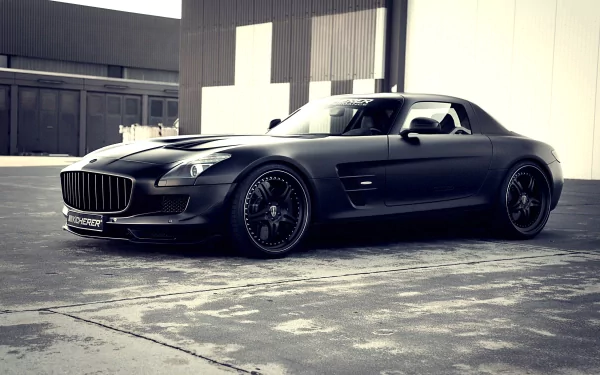 A sleek black Kicherer Mercedes-Benz SLS AMG with gull-wing doors, showcased as a high-definition PC desktop wallpaper and background.