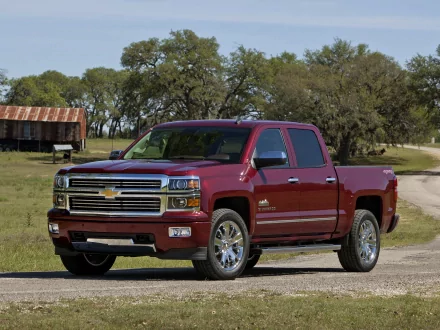2013 Chevrolet Silverado High Country Crew Cab pickup truck parked on a rural road, featured as an HD PC desktop wallpaper and background.