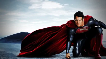 HD wallpaper featuring Superman, portrayed by Henry Cavill, in a dynamic pose from the movie Man of Steel, set against a breathtaking landscape.