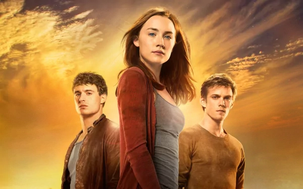 A dramatic scene featuring Max Irons, Jake Abel, and Saoirse Ronan from the movie *The Host* (2013), set against an atmospheric sunset backdrop.