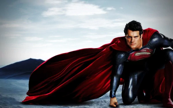 HD wallpaper featuring Superman, portrayed by Henry Cavill, in a dynamic pose from the movie Man of Steel, set against a breathtaking landscape.