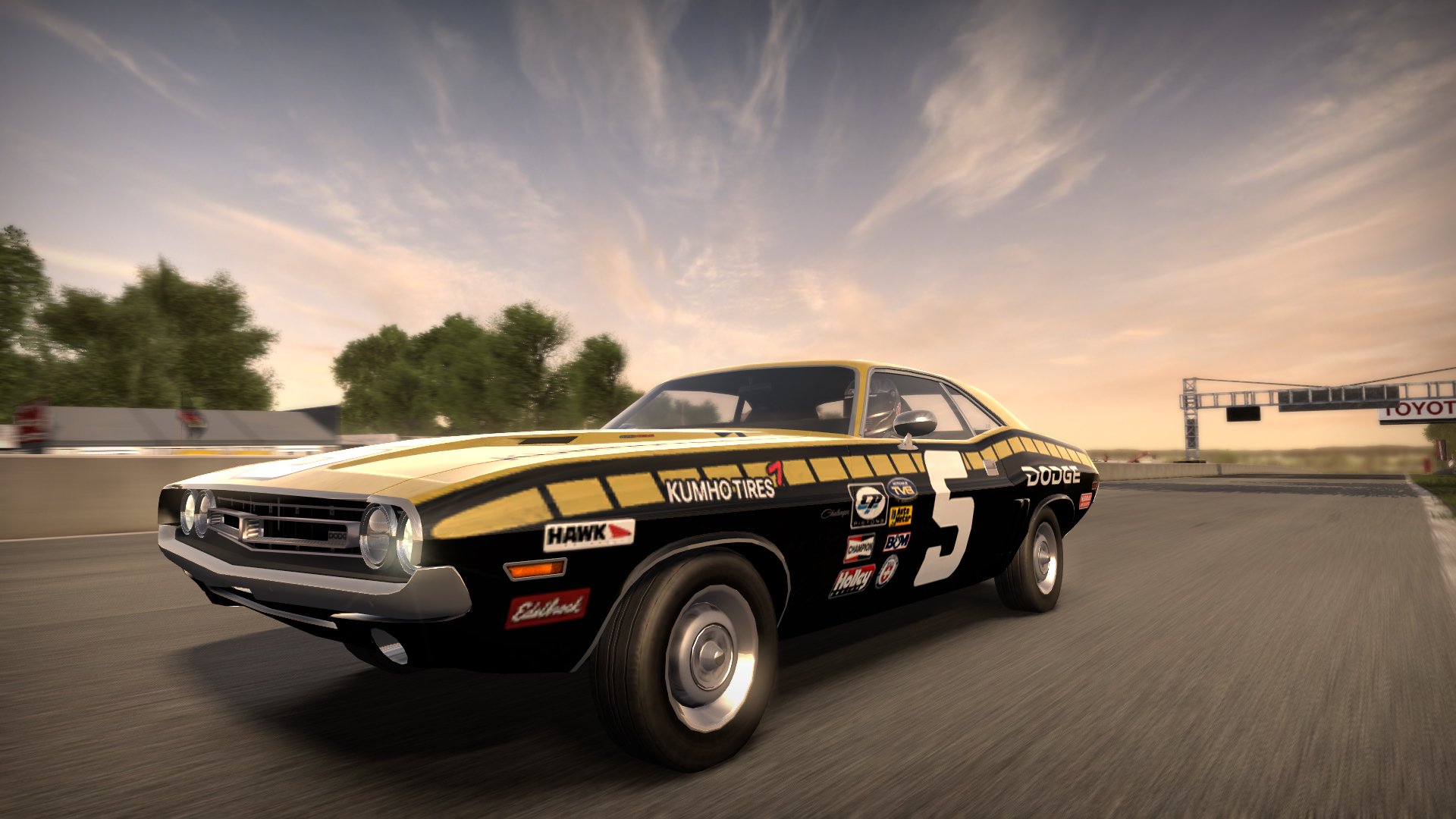HD PC desktop wallpaper featuring a classic muscle car racing on a track from the video game Need For Speed.