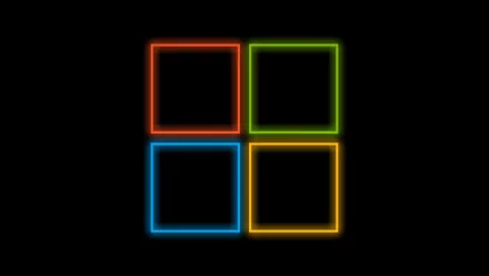 An abstract HD desktop wallpaper featuring four neon squares in red, green, blue, and yellow against a black background.