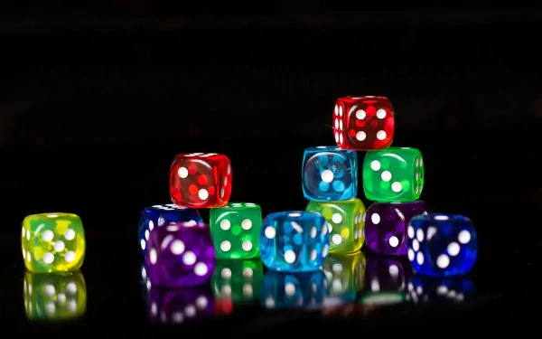 A vibrant stack of colorful dice, including red, blue, green, and yellow, reflecting against a dark background, creating a striking visual for a HD PC desktop wallpaper.