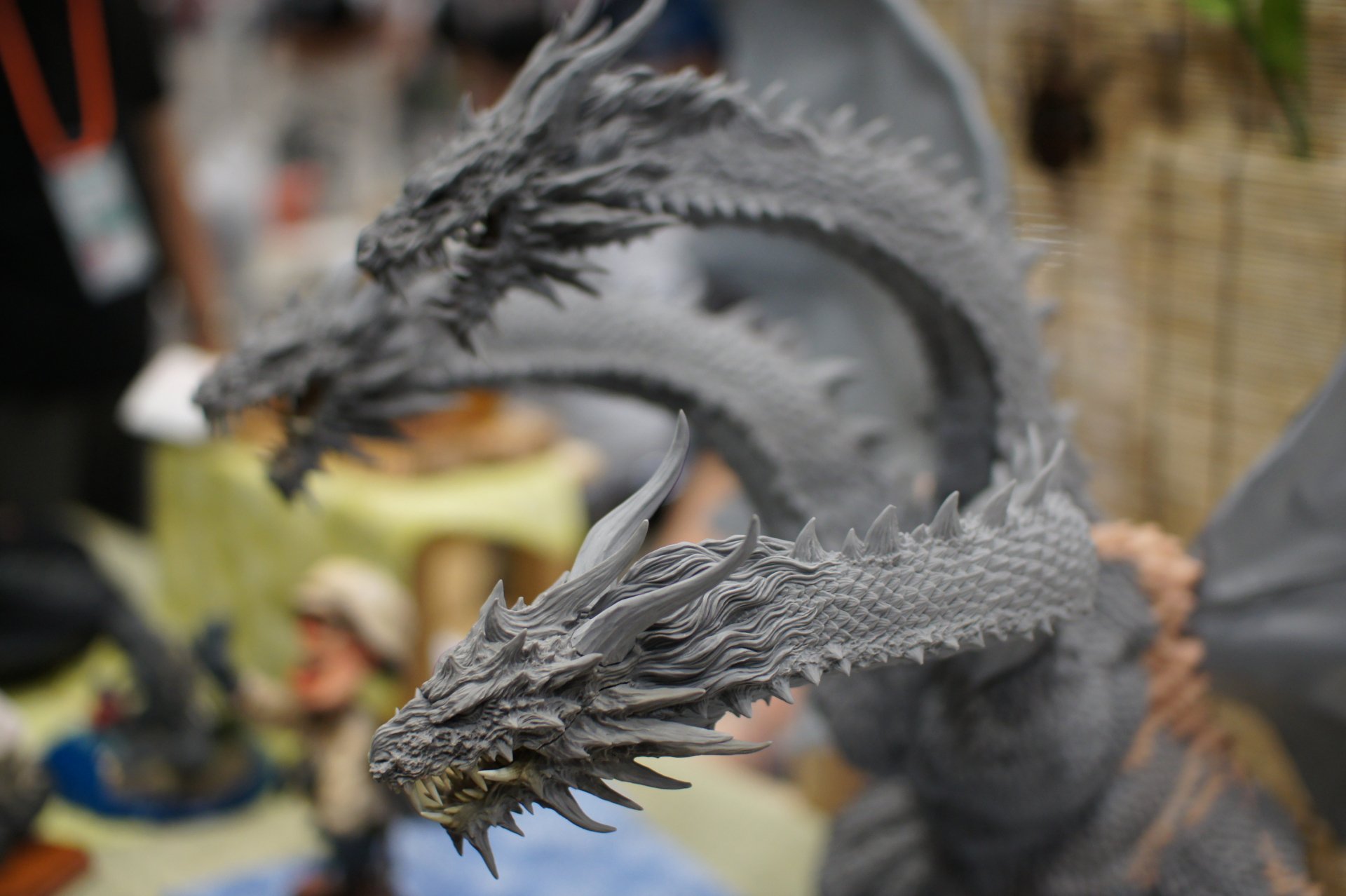 A detailed grayscale fantasy dragon sculpture in 4K Ultra HD, captured as a striking PC desktop wallpaper and background.