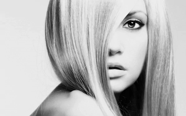 Black and white 4K Ultra HD desktop wallpaper of a woman with sleek, straight hair partially covering one eye.