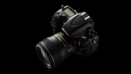 High-resolution image of a Nikon D800 DSLR camera with detailed lens and controls, set against a black background, designed as a PC desktop wallpaper.